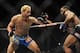 Nov 16, 2013; Las Vegas, NV, USA; Josh Koscheck (red gloves) fights against Tyron Woodley (blue gloves) in their welterweight bout during UFC 167 at MGM Grand Garden Arena. Mandatory Credit: Stephen R. Sylvanie-USA TODAY Sports