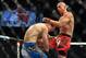Nov 16, 2013; Las Vegas, NV, USA; Donald Cerrone (red gloves) fights against Evan Dunham (blue gloves) in their lightweight bout during UFC 167 at MGM Grand Garden Arena. Mandatory Credit: Stephen R. Sylvanie-USA TODAY Sports