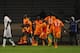 CASABLANCA, MOROCCO - NOVEMBER 16: Team mates run to celebrate with Salomon Kalou of Ivory Coast after his last minute goal ensured victory during the FIFA 2014 World Cup Qualifier Play-off Second Leg between Senegal and Ivory Coast at Stade Mohammed V o