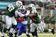 EAST RUTHERFORD, NJ - SEPTEMBER 22: Running back C.J. Spiller #28 of the Buffalo Bills attempts to break free from defensive tackle Kenrick Ellis #93 and defensive end Quinton Coples #98 of the New York Jets during the second quarter in a game at MetLife