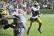Nov 16, 2013; Evanston, IL, USA; Michigan Wolverines quarterback Devin Gardner (98) runs for a two point conversion in the third overtime against the Northwestern Wildcats at Ryan Field. The Michigan Wolverines defeated the Northwestern Wildcats 27-19 in