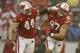 MADISON, WI - NOVEMBER 16: Jack Russell #97 of the Wisconsin Badgers celebrates with Chris Borland #44 after making a interception during the first half of play against the Indiana Hoosiers at Camp Randall Stadium on November 16, 2013 in Madison, Wisconsi