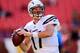LANDOVER, MD - NOVEMBER 03: Quarterback Philip Rivers #17 of the San Diego Chargers throws a pass while warming up before the start of the Chargers game against the Washington Redskins at FedExField on November 3, 2013 in Landover, Maryland. (Photo by