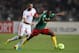 RADES, TUNISIA - OCTOBER 13: Enouh Takang Eyong of Cameroon battles with Yassin Chikhaoui of Tunisia during the FIFA 2014 World Cup qualifier at the Stade Olympique de Radès on October 13, 2013 in Rades, Tunisia. (Photo by Jamie McDonald/Getty Images)