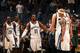 Mike Conley leads his team in a preseason game this season.
