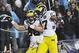 Nov 16, 2013; Evanston, IL, USA; Michigan Wolverines tight end Jake Butt (88) celebrates his touchdown catch in the first overtime with tight end Devin Funchess (87) against the Northwestern Wildcats at Ryan Field. The Michigan Wolverines defeated the N