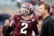 COLLEGE STATION, TX - NOVEMBER 09: Johnny Manziel #2 of the Texas A&M Aggies chats with his quarterback coach Jake Spavital before the game against the Mississippi State Bulldogs at Kyle Field on November 9, 2013 in College Station, Texas. (Photo by Sco