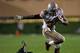 EVANSTON, IL - OCTOBER 05: Carlos Hyde #34 of the Ohio State Buckeyes runs over Matthew Harris #27 of the Northwestern Wildcats at Ryan Field on October 5, 2013 in Evanston, Illinois. Ohio State defeated Northwestern 40-30. (Photo by Jonathan Daniel/Get