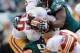 PHILADELPHIA, PA - NOVEMBER 17: Quarterback Robert Griffin III #10 of the Washington Redskins is tackled by defensive end Fletcher Cox #91 and outside linebacker Connor Barwin #98 of the Philadelphia Eagles during the second half of the Eagles 24-16 win