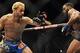Nov 16, 2013; Las Vegas, NV, USA; Josh Koscheck (red gloves) fights against Tyron Woodley (blue gloves) in their welterweight bout during UFC 167 at MGM Grand Garden Arena. Mandatory Credit: Stephen R. Sylvanie-USA TODAY Sports