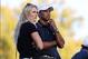 Oct 3, 2013; Dublin, OH, USA; USA skier Lindsey Vonn and Tiger on the 17th green during the Thursday four ball matches of the Presidents Cup at Muirfield Village Golf Club. Mandatory Credit: Peter Casey-USA TODAY Sports