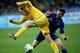 KIEV, UKRAINE - NOVEMBER 15: Laurent Koscielny of France (R) fouls Roman Zozulya of Ukraine (L), resulting in a penalty kick during the FIFA 2014 World Cup Qualifier Play-off First Leg between Ukraine and France at the Olympic Stadium on November 15, 20