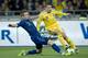 KIEV, UKRAINE - NOVEMBER 15: Mathieu Debuchy (L) of France fights for the ball with Ukraine's Yevhen Konoplyanka (R) during the FIFA 2014 World Cup Qualifier Play-off First Leg soccer match between Ukraine and France at the Olympic Stadium on November 15,