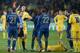KIEV, UKRAINE - NOVEMBER 15: Referee Cuneyt Cakir of Turkey shows red card to Laurent Koscielny (L) of France during the FIFA 2014 World Cup Qualifier Play-off First Leg soccer match between Ukraine and France at the Olympic Stadium on November 15, 2013 i