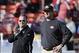December 30, 2012; San Francisco, CA, USA; San Francisco 49ers head coach Jim Harbaugh (right) and offensive coordinator Greg Roman (left) watch warm ups before the game against the Arizona Cardinals at Candlestick Park. Mandatory Credit: Kyle Terada-USA