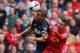 LIVERPOOL, ENGLAND - SEPTEMBER 01: Iago Aspas of Liverpool battles with Nemanja Vidic of Manchester United during the Barclays Premier League match between Liverpool and Manchester United at Anfield on September 01, 2013 in Liverpool, England. (Photo by