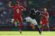 LIVERPOOL, ENGLAND - SEPTEMBER 21: Victor Wanyama of Southampton tackles Iago Aspas of Liverpool during the Barclays Premier League match between Liverpool and Southampton at Anfield on September 21, 2013 in Liverpool, England. (Photo by Clive Brunskill