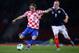 GLASGOW, SCOTLAND - OCTOBER 15: Luka Modric of Croatia shoots watched by Steven Naismith of Scotland during the FIFA 2014 World Cup Qualifying Group A match between Scotland and Croatia at Hampden Park on October 15, 2013 in Glasgow, Scotland. (Photo by