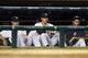 Aug 26, 2013; Detroit, MI, USA; Detroit Tigers starting pitcher Max Scherzer (left), starting pitcher Rick Porcello (center) and starting pitcher Justin Verlander (right) watch from the dugout in the seventh inning against the Oakland Athletics at Comeric