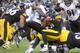 PITTSBURGH, PA - OCTOBER 20: Le'Veon Bell #26 of the Pittsburgh Steelers is tackled by James Ihedigbo # 32 of the Baltimore Ravnes during the third quarter at Heinz Field on October 20, 2013 in Pittsburgh, Pennsylvania. (Photo by Vincent Pugliese/Getty I