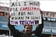 December 23, 2012; Jacksonville, FL, USA; A Jacksonville fan holds up a sign referencing trading New York Jets quarterback Tim Tebow (not pictured) to the Jaguars during the second half of the game against the New England Patriots at EverBank Field. The P