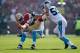 SAN FRANCISCO, CA - NOVEMBER 10: Mario Manningham #82 of the San Francisco 49ers is tackled by Captain Munnerlyn #41 and Luke Kuechly #59 of the Carolina Panthers at Candlestick Park on November 10, 2013 in San Francisco, California. (Photo by Ezra Shaw