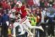 Nov 16, 2013; Madison, WI, USA; Wisconsin Badgers wide receiver Jared Abbrederis (4) runs for a touchdown during the second quarter past Indiana Hoosiers defensive back Tim Bennett (24) at Camp Randall Stadium. Mandatory Credit: Jeff Hanisch-USA TODAY Spo