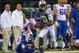 EAST RUTHERFORD, NJ - SEPTEMBER 22: Wide receiver Santonio Holmes #10 of the New York Jets runs after the catch for a 69 yard touchdown in the 2nd half of the Jets 27-20 win over the Buffalo Bills at MetLife Stadium on September 22, 2013 in East Rutherfor