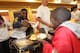 INDIANAPOLIS - NOVEMBER 14: Roy Hibbert of the Indiana Pacers serves up a dish as part of the Pacers 16th Annual 'Come to Our House' Thanksgiving Diner at Bankers Life Fieldhouse on November 14, 2013 in Indianapolis, Indiana. NOTE TO USER: User expressl