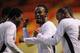 LONDON, ENGLAND - AUGUST 12: Michael Essien of Ghana celebrates with his team mates after Haminu Draman scores the third goal during the International Friendly match between Ghana and Zambia at Brisbane Road on August 12, 2009 in London, England. (Photo