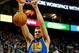 Nov 18, 2013; Salt Lake City, UT, USA; Golden State Warriors center Andrew Bogut (12) dunks the ball over Utah Jazz center Enes Kanter (0) during the second quarter at EnergySolutions Arena. Mandatory Credit: Chris Nicoll-USA TODAY Sports