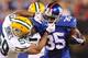 EAST RUTHERFORD, NJ - NOVEMBER 17: Brad Jones #59 of the Green Bay Packers grabs the facemask of Andre Brown #35 of the New York Giants during the first half at MetLife Stadium on November 17, 2013 in East Rutherford, New Jersey. (Photo by Maddie Meyer/