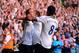 LONDON, ENGLAND - AUGUST 25: Roberto Soldado (L) of Spurs celebrates with teammates Andros Townsend (C) and Paulinho (R) after scoring the opening goal from the penalty spot during the Barclays Premier League match between Tottenham Hotspur and Swansea C