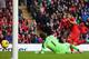LIVERPOOL, ENGLAND - NOVEMBER 09: Luis Suarez of Liverpool scores the third goal during the Barclays Premier League match between Liverpool and Fulham at Anfield on November 9, 2013 in Liverpool, England. (Photo by Alex Livesey/Getty Images)