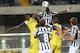 VERONA, ITALY - SEPTEMBER 25: Boukary Drame' (L) of AC Chievo Verona competes with Paul Pogba of Juventus during the Serie A match between AC Chievo Verona and Juventus at Stadio Marc'Antonio Bentegodi on September 25, 2013 in Verona, Italy. (Photo by Di