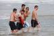 FORTALEZA, BRAZIL - JUNE 24: Fernando Torres (R) and Juan Mata of Spain walk with fans out of the sea after a swim at the Playa Futuro on June 24, 2013 in Fortaleza, Brazil. (Photo by Jasper Juinen/Getty Images)