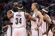 Nov 15, 2013; Phoenix, AZ, USA; Brooklyn Nets forward Kevin Garnett (2) talks with forward Paul Pierce (34) , forward Mason Plumlee (1) and guard Jason Terry (31) on the court in the second half of the game against the Phoenix Suns at US Airways Center. T
