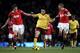 MANCHESTER, ENGLAND - DECEMBER 13: Samir Nasri of Arsenal competes with Darren Fletcher (R) and Michael Carrick of Manchester United during the Barclays Premier League match between Manchester United and Arsenal at Old Trafford on December 13, 2010 in Ma