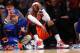 NEW YORK, NY - NOVEMBER 16: Carmelo Anthony #7 of the New York Knicks sits on the baseline during the final minutes of the game against the Atlanta Hawks at Madison Square Garden on November 16, 2013 in New York City. The Hawks defeat the Knicks 110-90.