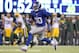 Nov 17, 2013; East Rutherford, NJ, USA; New York Giants defensive end Jason Pierre-Paul (90) runs back an interception against the Green Bay Packers for a touchdown during the fourth quarter of a game at MetLife Stadium. Mandatory Credit: Brad Penner-USA