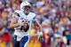 Nov 3, 2013; Landover, MD, USA; San Diego Chargers quarterback Philip Rivers (17) runs with the ball against the Washington Redskins at FedEx Field. Mandatory Credit: Geoff Burke-USA TODAY Sports