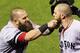 ST LOUIS, MO - OCTOBER 27: Mike Napoli #12 of the Boston Red Sox pulls teammate Jonny Gomes #5 beard after hitting a three run home run to left field against Seth Maness #61 of the St. Louis Cardinals in the sixth inning during Game Four of the 2013 Worl