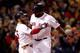BOSTON, MA - OCTOBER 24: David Ortiz #34 of the Boston Red Sox celebrates with Dustin Pedroia #15 after hitting a two run home run in the sixth inning against the St. Louis Cardinals during Game Two of the 2013 World Series at Fenway Park on October 24,