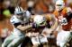AUSTIN, TX - NOVEMBER 19: Jordan Voelker #57 of Kansas State Wildcats tackles David Ash #14 of the Texas Longhorns in the first half of a game at Darrell K. Royal-Texas Memorial Stadium on November 19, 2011 in Austin, Texas. (Photo by Darren Carroll/Gett