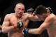Mar 16, 2013; Montreal, Quebec, CAN; Georges St.Pierre (red) and Nick Diaz (blue) exchange blows during their Welterweight title bout at UFC 158 at the Bell Centre. Mandatory Credit: Eric Bolte-USA TODAY Sports