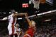 MIAMI, FL - NOVEMBER 12: Dwyane Wade #3 of the Miami Heat blocks a sot from Nate Wolters #6 of the Milwaukee Bucks during a game at AmericanAirlines Arena on November 12, 2013 in Miami, Florida. NOTE TO USER: User expressly acknowledges and agrees that,