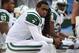 ORCHARD PARK, NY - NOVEMBER 17: Geno Smith #7 of the New York Jets looks on from the bench after throwing an interception during NFL game action against the Buffalo Bills at Ralph Wilson Stadium on November 17, 2013 in Orchard Park, New York. (Photo by To