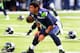 SEATTLE, WA. - NOVEMBER 17: Quarterback Russell Wilson #3 of the Seattle Seahawks warms up before the game against the Minnesota Vikings at CenturyLink Field on November 17, 2013 in Seattle,Wa. (Photo by Steve Dykes/Getty Images)