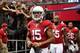 GLENDALE, AZ - OCTOBER 27: Wide receiver Michael Floyd #15 of the Arizona Cardinals leads John Abraham #55 and Rashad Johnson #26 onto the field before the NFL game against the Atlanta Falcons at the University of Phoenix Stadium on October 27, 2013 in G