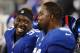 EAST RUTHERFORD, NJ - NOVEMBER 17: Jason Pierre-Paul #90 talks with Justin Tuck #91 of the New York Giants on the bench during the fourth quarter against the Green Bay Packers at MetLife Stadium on November 17, 2013 in East Rutherford, New Jersey. The Gi